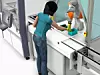 in einer Simulation arbeitet eine Frau mit einem Roboter ohne Schutzzaun zusammen