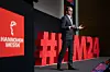Jochen Köckler, Vorstandsvorsitzender der Deutschen Messe AG, vor Logo und Hashtag der Hannover Messe 2024