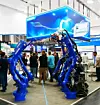 Automatica 2025: Bei Yaskawa stehen die Roboter Spalier für die Standbesucher.