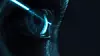A futuristic mechanical eye with neon blue light shining on a minimalist dark background, showcasing sci-fi aesthetics and advanced technology concepts.