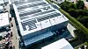 Bei mehreren Kunden von Greenflash ist die neu entwickelte, KI-basierte Software Greencore AI bereits im Einsatz und generiert massive Kosten- und CO2-Einsparungen. Das Bild zeigt das Energiesystem mit PV und Speicher der Unternehmen Giga Coating und System Trailers in Twist im Emsland, mit einer Gesamtleistung von mehr als 2 MWp.
